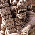 One of the many stone guardians surrounding Tirta Empul.