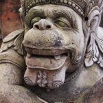 One of the many stone guardians surrounding Tirta Empul.