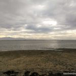 Two fishermen make their way to the other sandbars surrounding Tondol White Sand Beach
