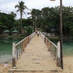 Bridge to one of the many resorts at Patar White Sand Beach