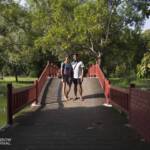 Man and woman standing on a bridge