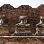 Buddha statues seated on pedestals