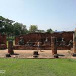 Buddha statues seated on pedestals