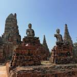 Buddha statues seated on pedestals