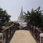 Bridge leading to white chedi