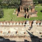 Wat Yai Chai Mongkhol's main temple is surrounded by statues of Buddha