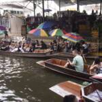 Floating market with boats of tourists and peddlers