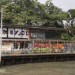 Graffiti-filled wall along one of the many canals that criss-cross Bangkok