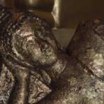 Reclining Buddha in one of the smaller halls of Lucky Buddha Temple in Bangkok