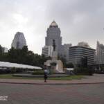 High-rise buildings with man standing at he forefront